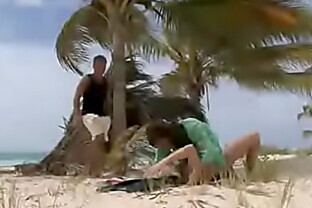 A Blonde and Brunette on the Tropical Beach Getting Screwed