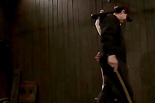 Gagged slut is shackled and caned