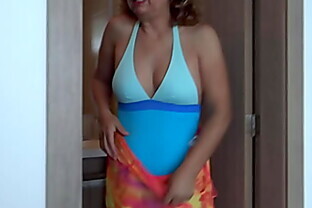 58-year-old Latina wife shows off in swimsuit on the beach