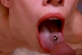 PIGTAILED CUTIE TAKES THICK LOAD ON HER OUTSTRETCHED PIERCED TONGUE CLOSEUP