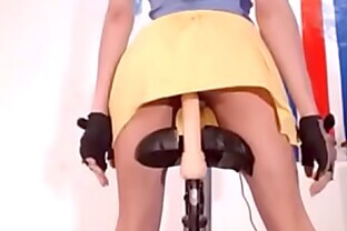 Teen riding dildo on bike
