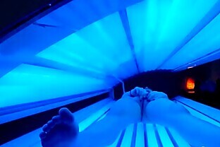 teen latina gets caught rubbing her clit while using a tanning bed