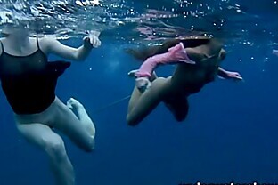Nastya and Masha are swimming nude in the sea
