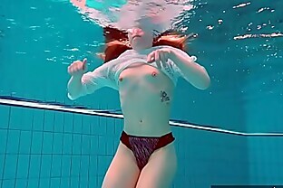 Pierced teen swimming