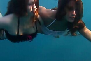Nastya and Masha are swimming nude in the sea